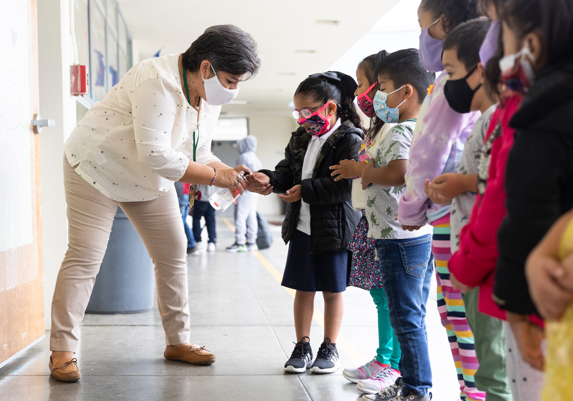 Tears, hugs and masks as parents send their children back to school ...